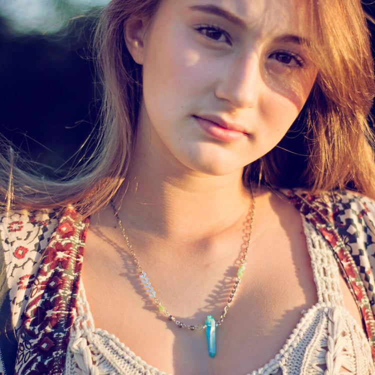 aqua aura // blue quartz crystal pendant necklace worn on model by Peacock & Lime