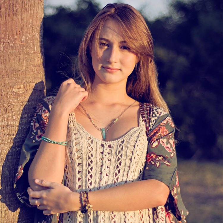 aqua aura // blue quartz crystal pendant necklace worn on model by Peacock & Lime