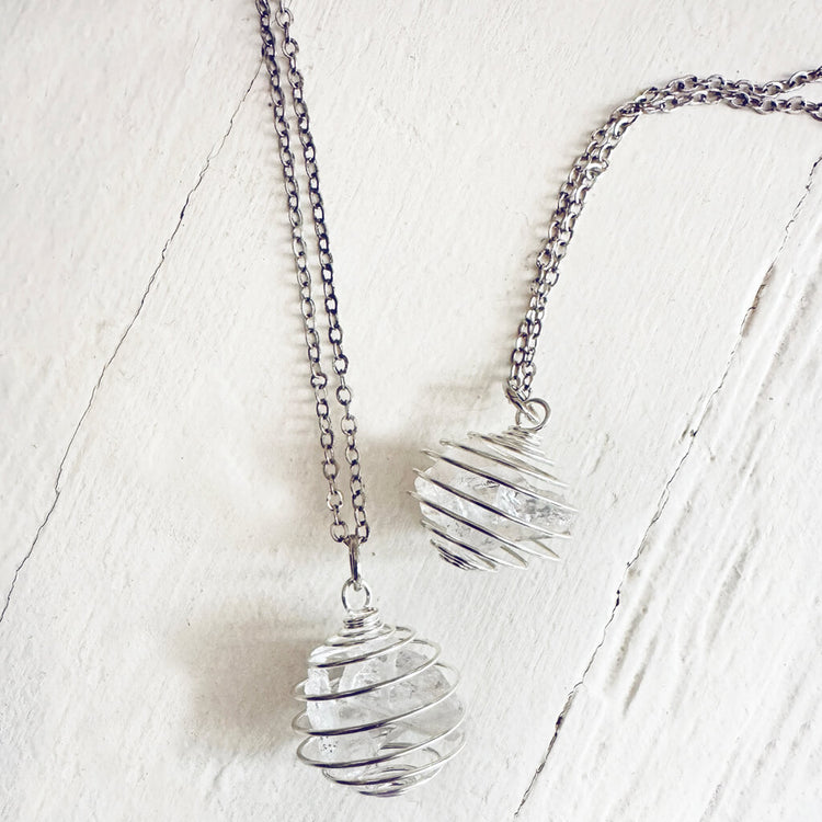 encapsulate silver // caged rock quartz crystal gemstone necklace by Peacock & Lime