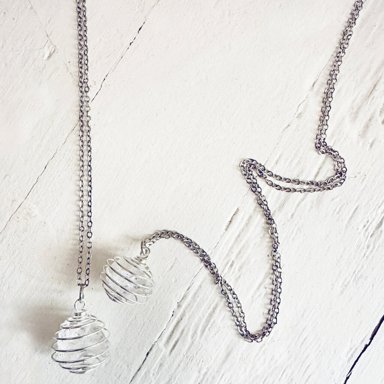 encapsulate silver // caged rock quartz crystal gemstone necklace by Peacock & Lime