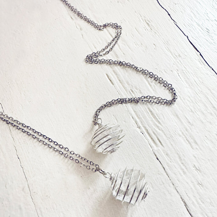encapsulate silver // caged rock quartz crystal gemstone necklace by Peacock & Lime