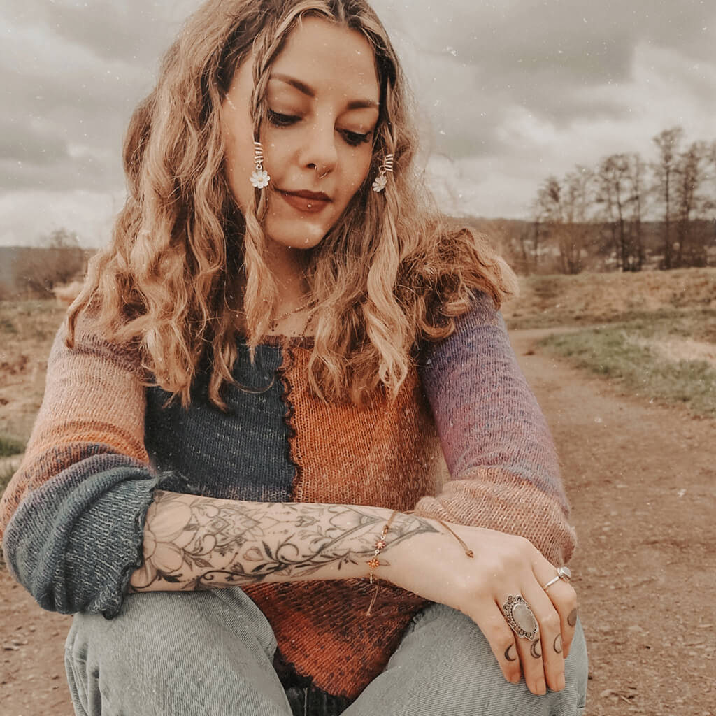 flower child // multi color enamel daisy flower chain and adjustable cord bracelet worn on model - by Peacock & Lime