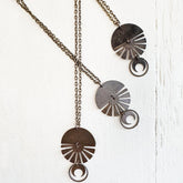orbis // patina aged darkened sun, moon, sphere & crescent moon necklaces - Peacock & Lime