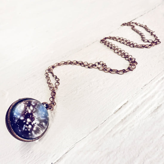 out of this world // glow in the dark galaxy sphere pendant necklace by peacock and lime