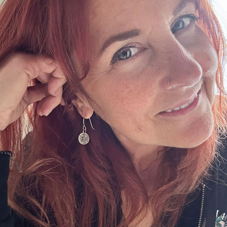 starlight // silver star coin dangle earrings worn on model by Peacock and Lime