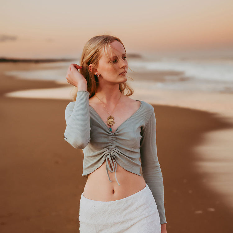sun down // crescent moon, sun rays & tassel drop necklace worn on model by Peacock & Lime