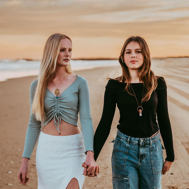 sun down // crescent moon, sun rays & tassel drop necklace and Enchantment / electroformed roller ball gemstone necklace worn on models by Peacock & Lime
