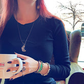 Under an Amethyst Moon // copper electroformed crescent moon pendant necklace worn on model by Peacock & Lime