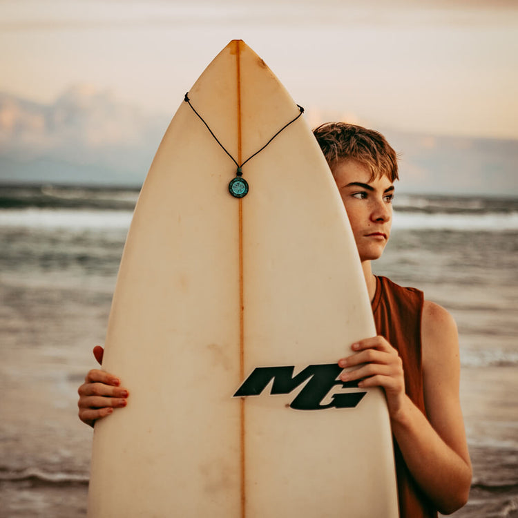 ancient path - men's medallion leather necklace worn on model Cody by Peacock and Lime