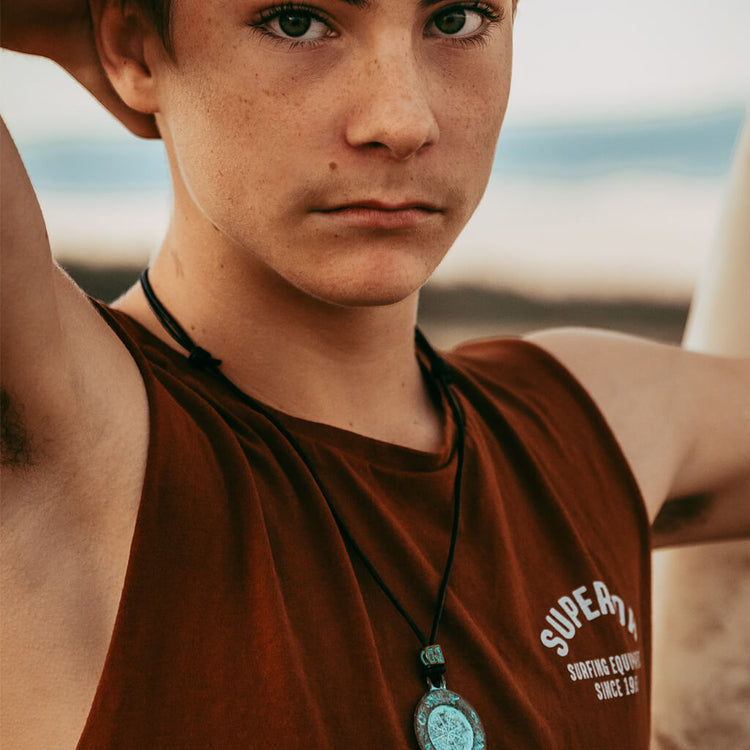 ancient path - men's medallion leather necklace worn on model Cody by Peacock and Lime