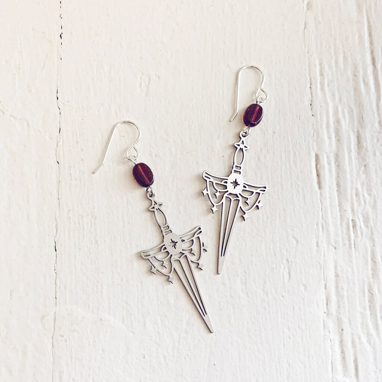 anelace // garnet and steel dagger earrings by Peacock and Lime