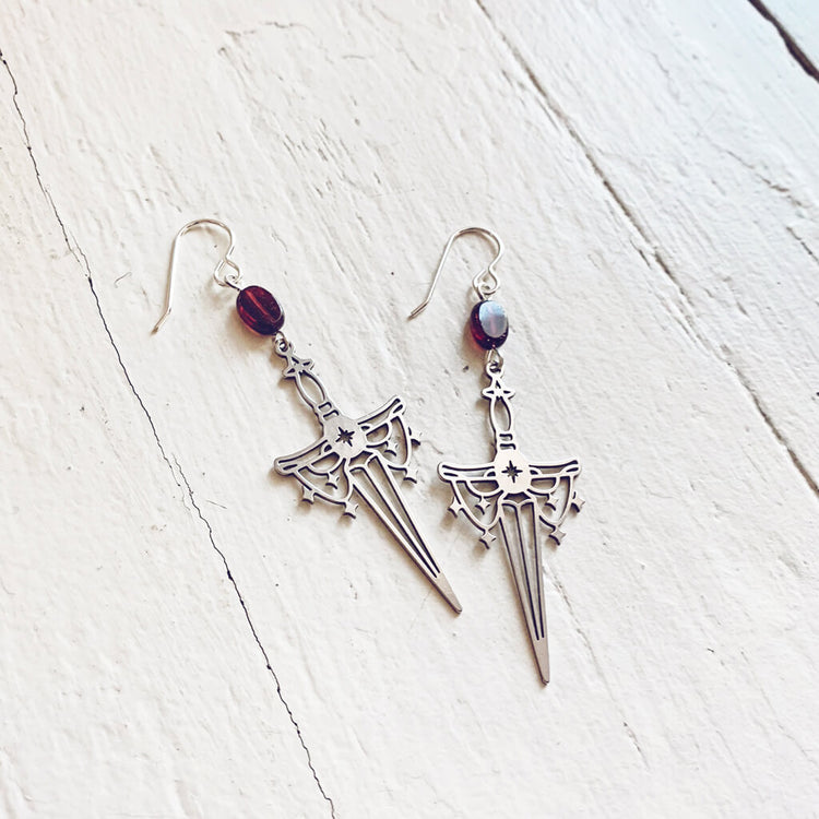 anelace // garnet and steel dagger earrings by Peacock and Lime