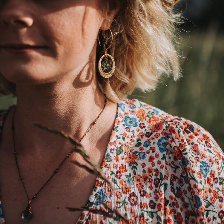 anemone // flower and embossed brass hoop earrings worn on model by Peacock and Lime