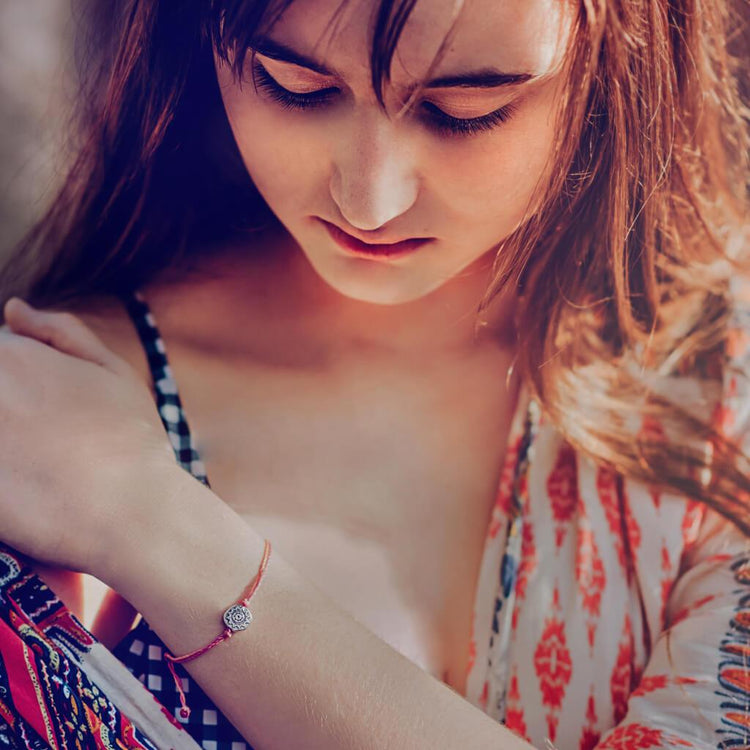 Beach break - radiant sun charm adjustable cord surf beach bracelet worn on model - Peacock & Lime