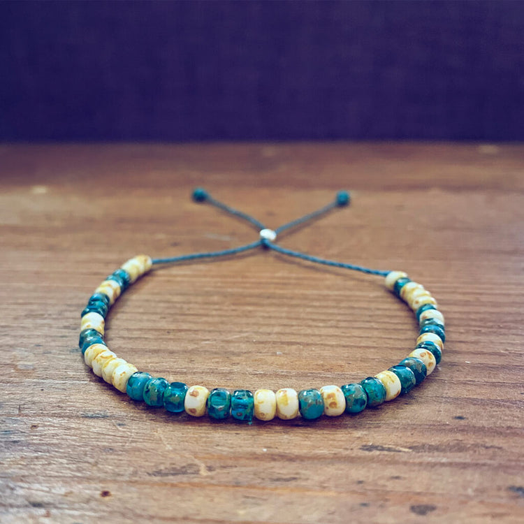 beach side // turquoise blue and white beaded cord bracelet by Peacock & Lime