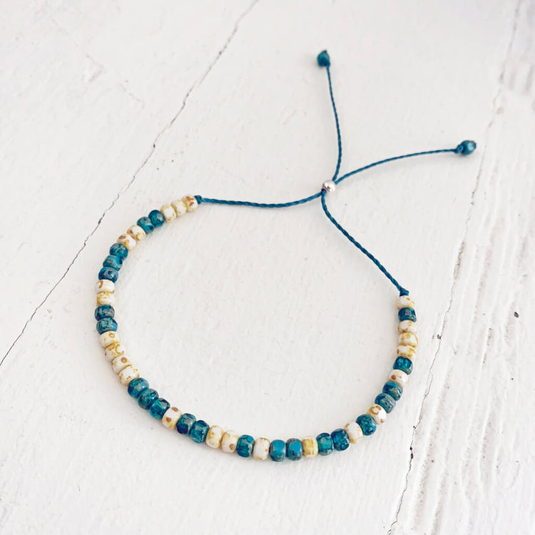beach side // turquoise blue and white beaded cord bracelet by Peacock & Lime