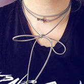 full of life // heartbeat arrow choker necklace - wrap bracelet worn on model - by Peacock and Lime