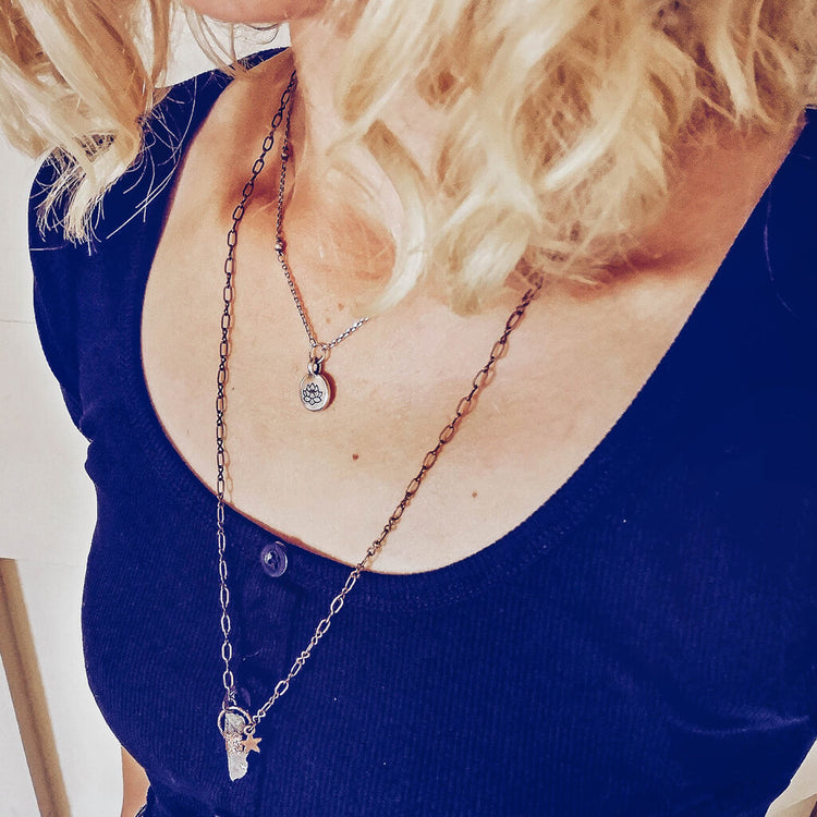 little lotus flower and synchronicity electroformed quartz necklaces by Peacock & Lime