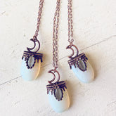 lux ex tenebris // copper electroformed opalite and crescent moon necklaces by Peacock and Lime