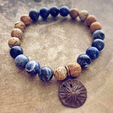 sand & sea // sodalite and picture jasper mala bead bracelet with sand dollar by Peacock & Lime