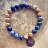 sand & sea // sodalite and picture jasper mala bead bracelet with sand dollar by Peacock & Lime