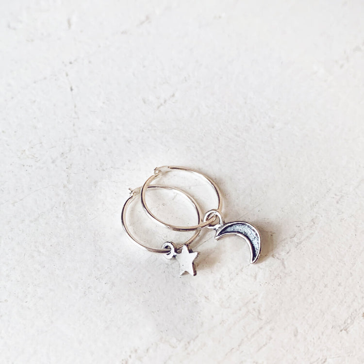 solasta // teeny tiny sterling silver star and crescent moon hoop earrings⁣ - Peacock & Lime