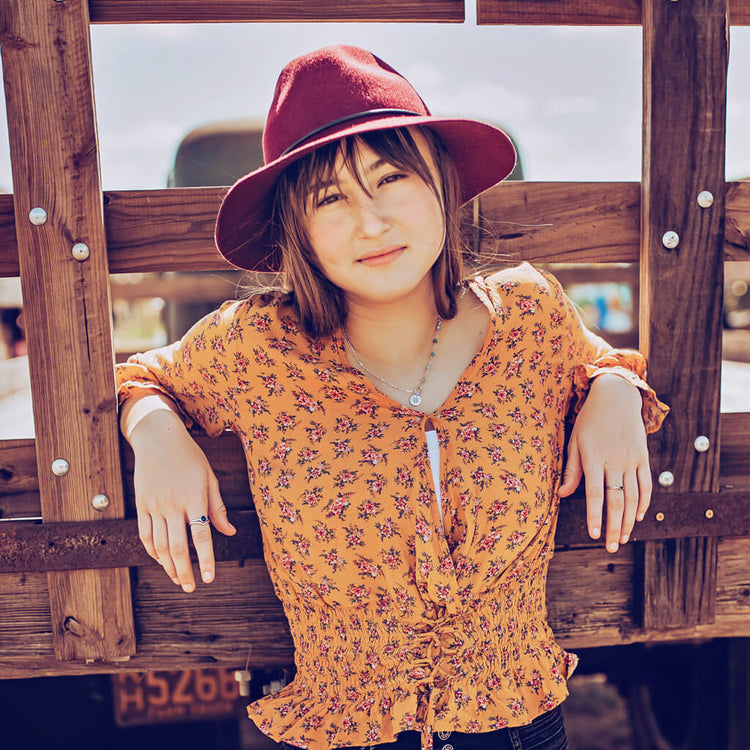 true north star compass necklace worn on model - Peacock & Lime