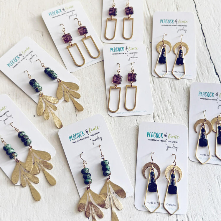 Long brass dangle earrings by Peacock & Lime