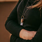 enchantment // copper electroformed crystal gemstone infused roller ball essential oil necklace worn on model - by Peacock and Lime