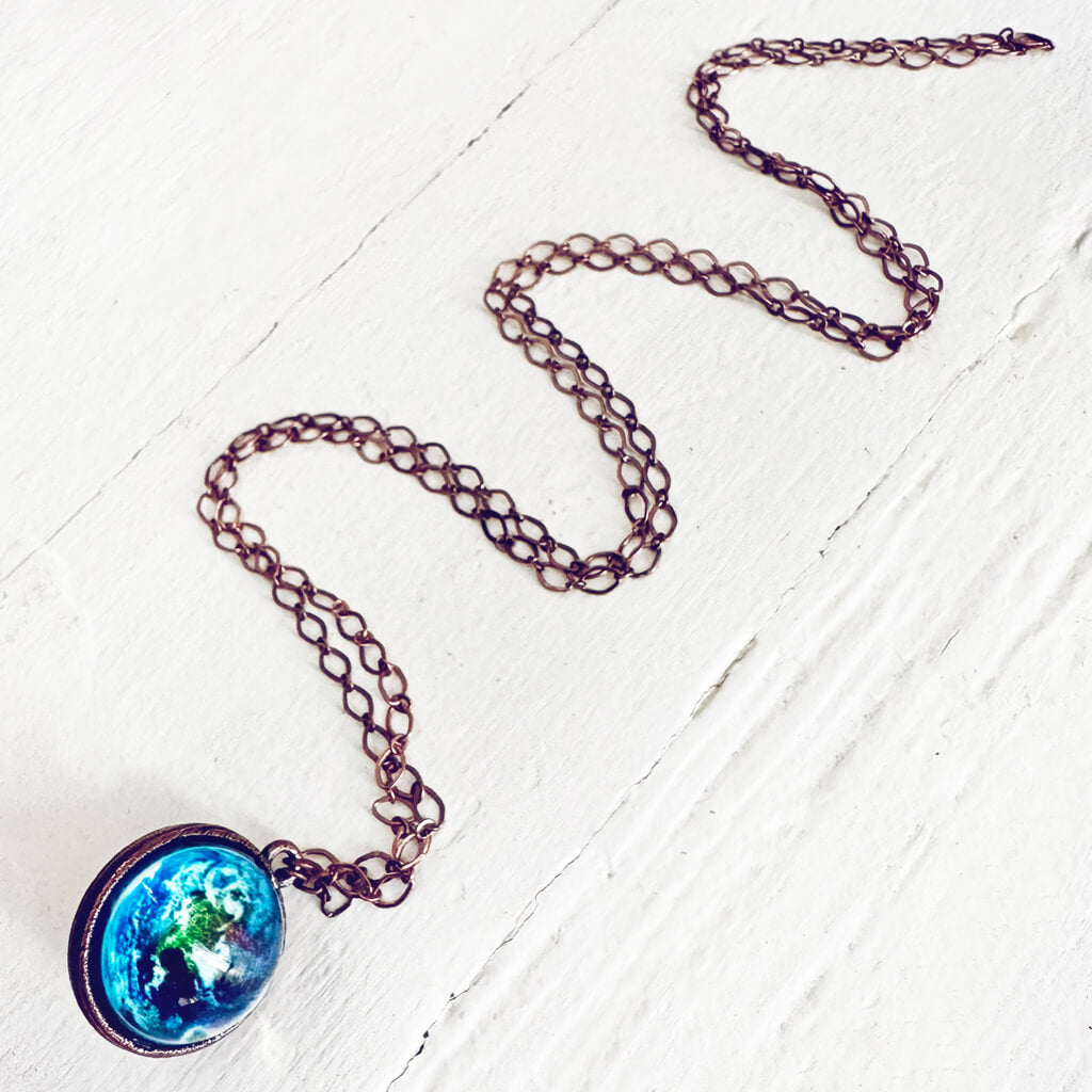 out of this world // glow in the dark bright universe sphere pendant necklace by peacock & lime