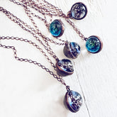 out of this world // glow in the dark galaxy sphere pendant necklaces by peacock and lime