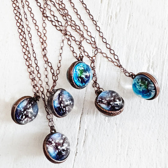 out of this world // glow in the dark galaxy sphere pendant necklaces by Peacock & Lime