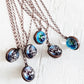 out of this world // glow in the dark galaxy sphere pendant necklaces by Peacock & Lime