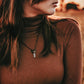synchronicity / copper electroplated quartz  gemstone pendant necklace worn on model, close up - Peacock & Lime