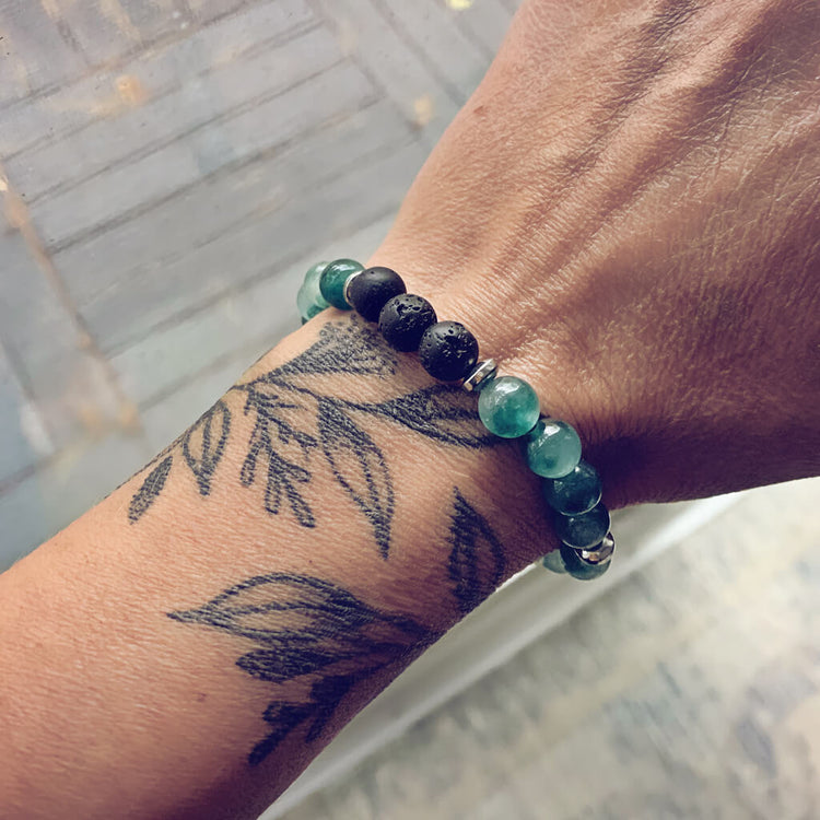 tide / caribbean sea green jade, lava rock and hematite mala bead bracelet worn on wrist - Peacock & Lime