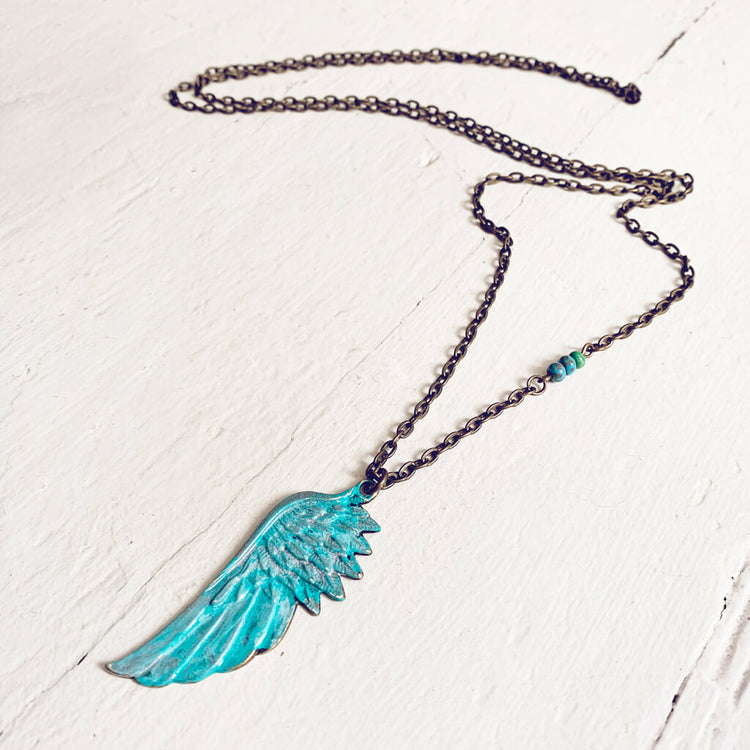 soteria hand painted patina wing pendant necklace by Peacock & Lime