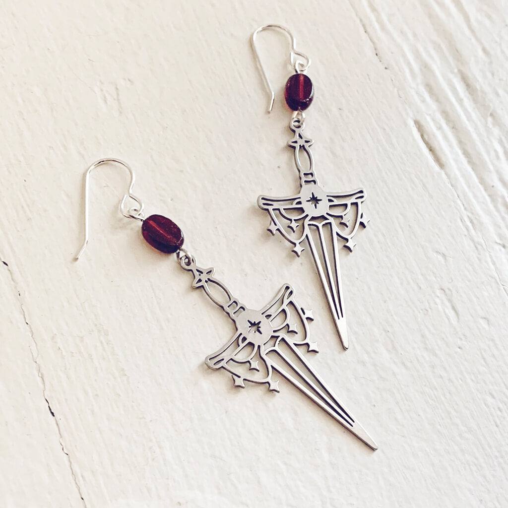 anelace // garnet and steel dagger earrings by Peacock and Lime