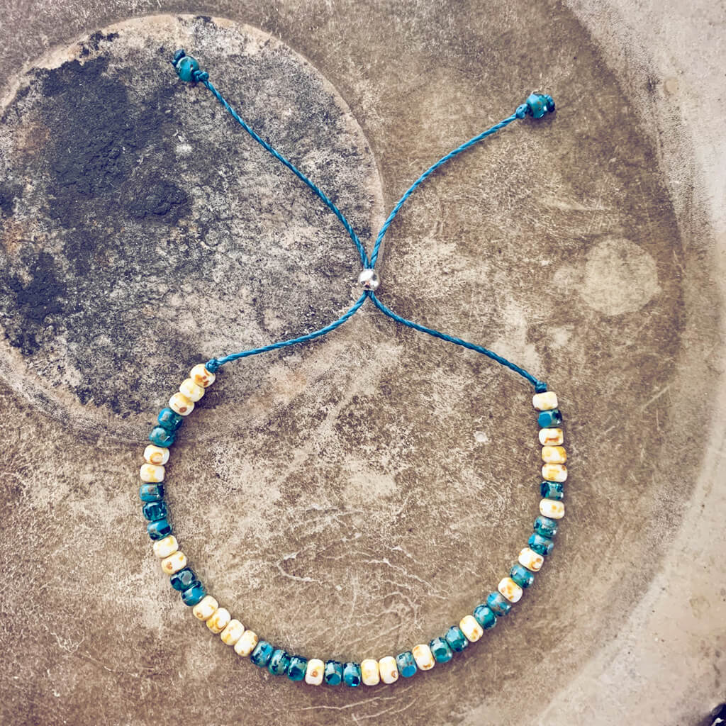 beach side // turquoise blue and white beaded cord bracelet by Peacock & Lime