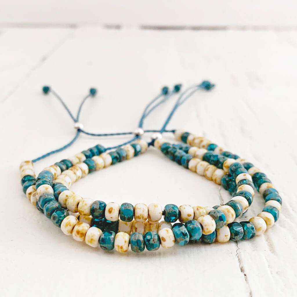 beach side // turquoise blue and white beaded cord bracelets by Peacock & Lime