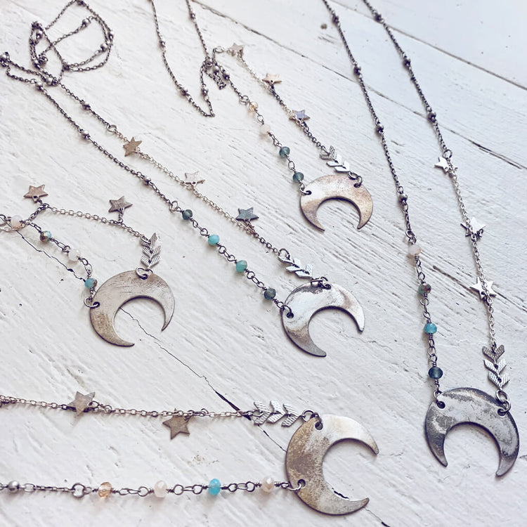 lunula // flame kissed silver boho crescent moon necklaces by Peacock & Lime