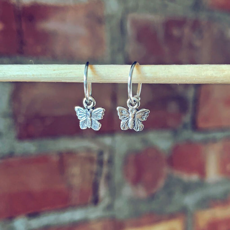 flutter // itty bitty sterling silver butterfly hoop sleeper earrings⁣ - Peacock & Lime