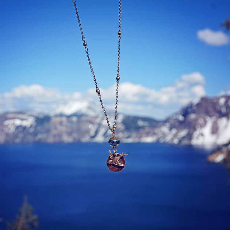 free bird - swallow and flame kissed copper moon pendant mixed metal necklace - by Peacock & Lime