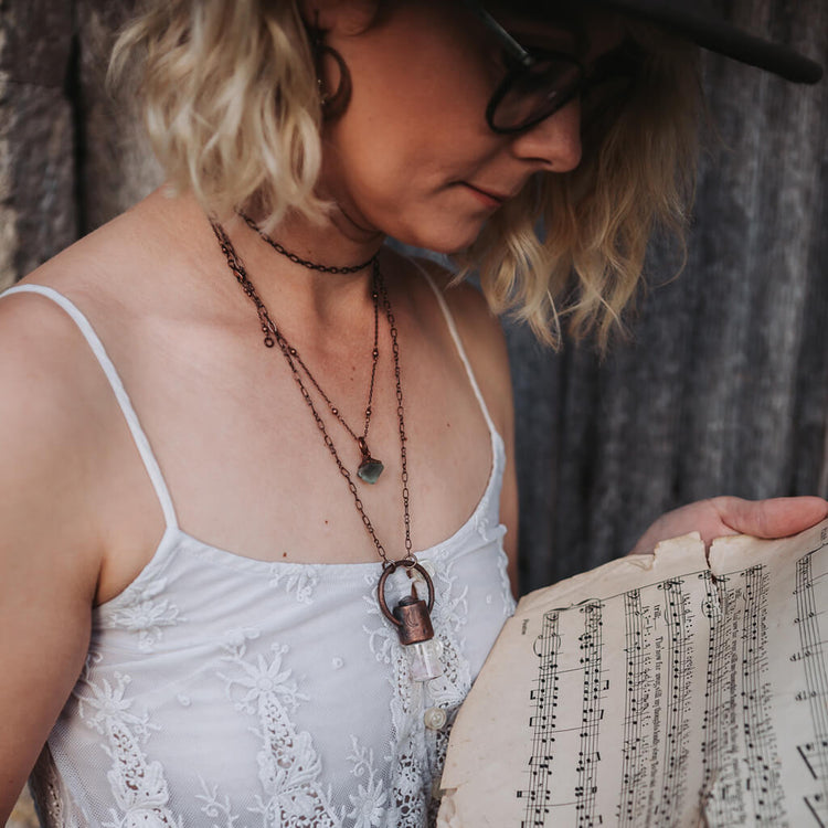 enchantment // copper electroformed crystal gemstone infused roller ball essential oil necklace worn on model with little gem necklace - by Peacock and Lime