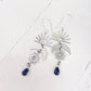 here comes the sun // rhodium & steel sun moon and beach glass dangle earrings by Peacock & Lime