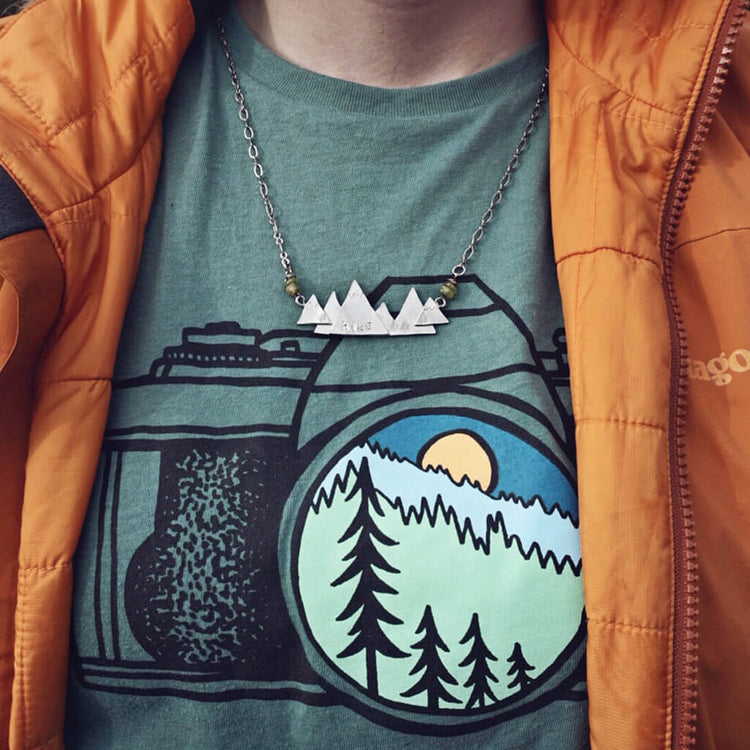 Hike / pewter mountain hand stamped pendant necklace worn on model by Peacock & Lime