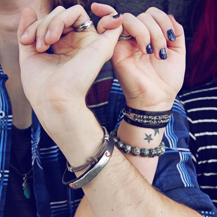 double hex // simple distressed grey brown leather knot bracelet with pewter hex beads shown on model with other bracelets by Peacock & Lime