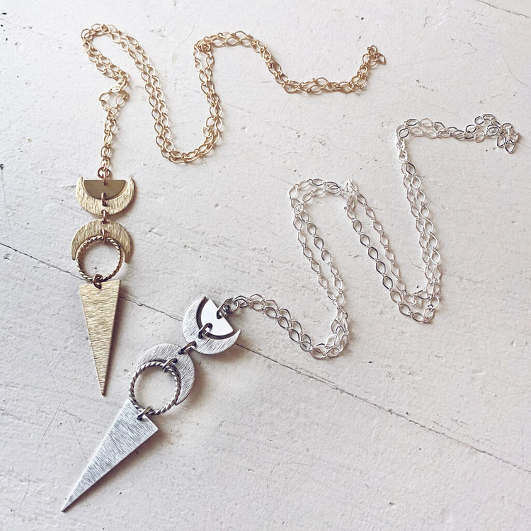 moon phases // half moon, waxing, waning crescent moons, new moon and long triangle pendant necklaces by Peacock & Lime