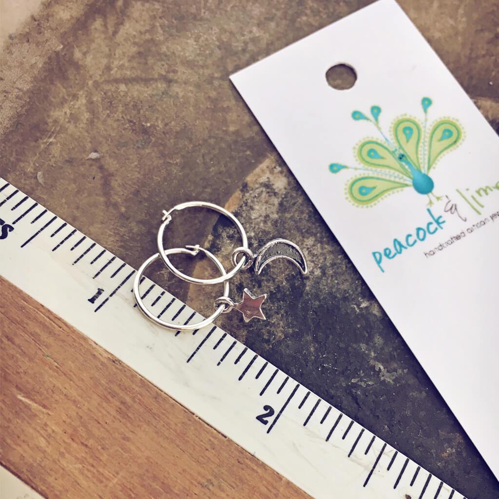 solasta // teeny tiny sterling silver star and crescent moon hoop earrings⁣ - Peacock & Lime