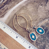 stargazer // enamel and brass oval starburst earrings - brass - by Peacock and Lime
